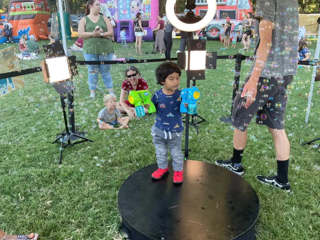 Guests at the 360 photo booth at Family Fun Fest